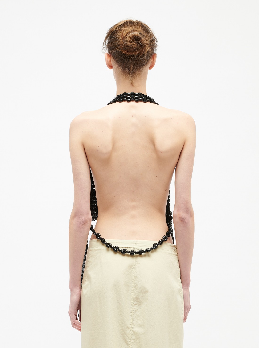 Gilet en perles de bois